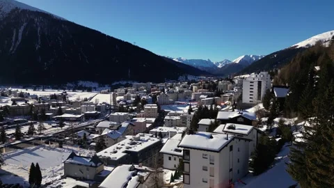 Wide view over the town of Davos and the valley in winter Stock Footage 345299493
