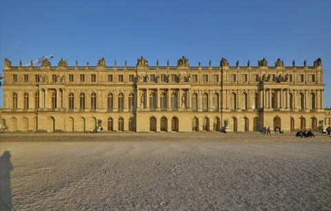 Wide view of Palace of Versailles facade at sunset Stock Photos