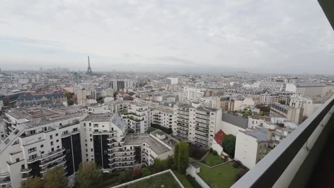 Wide view of Paris with Eiffel Tower in distance, push-in from balcony Stock Footage 290887585