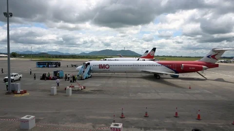 Wide view of passengers boarding a plane at Abuja International Airport Stock Footage 94905596