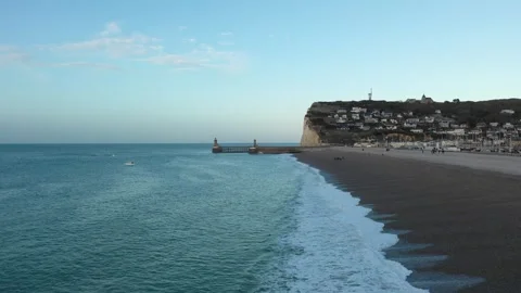 Wide view of the pebble beach and dramatic white cliffs at Fecamp, Normandy Stock Footage 346672454