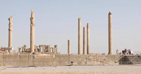 Wide View of Persepolis Columns and Relief Terrace with Tourists Iran Stock Footage 320461172