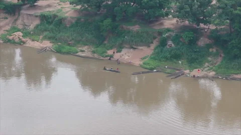 Wide view of pirogues on Oubangui River, Betou, Congo Stock Footage 331999017