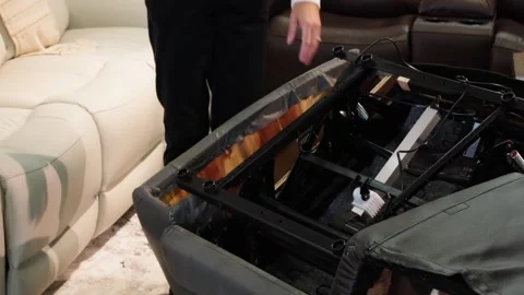 Wide View of Recliner Underside Mechanics Displayed on Store Floor Stock Footage 309842346