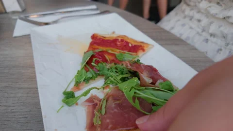 Wide view of a restaurant table with seafood pizza, prosciutto pizza, bread, Stock Footage 344816314