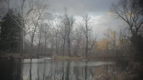 Wide View of River and Small Bridge Stock Footage 58929501