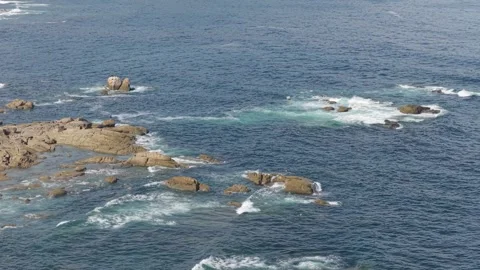 A wide view of the rugged Atlantic coastline near Baiona, Spain, showing rocky Stock Footage 346718531