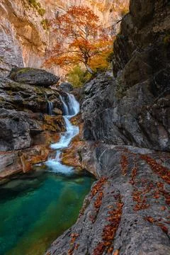 A wide view of the same autumn valley and river, though camera equipment is.. Stock Photos
