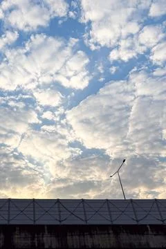 Wide view of scattered white clouds across a blue sky. Natural daylight cre.. Stock Photos