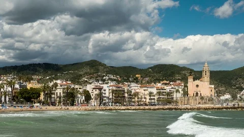 Wide view seafront of "SITGES". Smooth camera movement: Panning left.Hyper lapse Stock Footage 89811894