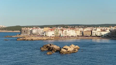Wide view of the seaside town of LEscala, Spain, featuring a Mediterranean Stock Footage 346720326