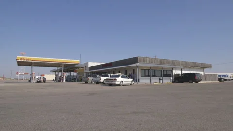 Wide View of Shell Gas Station during the day Stock Footage 139313594