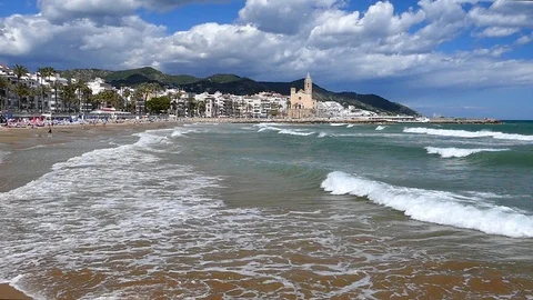 Wide view of "SITGES" from the beach.Slow motion. Stock Footage 90282719