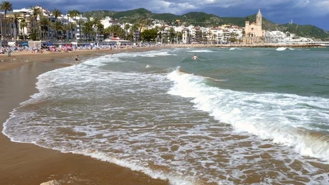 Wide view of "SITGES" from the beach.Time lapse. Stock Footage 90282460