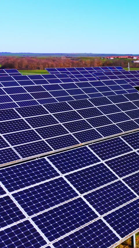 Wide view of solar panel field with rolling hills, Bulgaria Vertical video. 스톡 동영상 338008087
