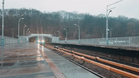 Wide view of the subway ariving to the station. Subway train goes out of tunnel Video stock 123179557
