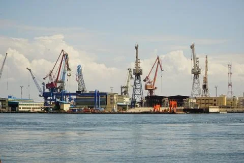 Wide view of Suez Canal in Egypt with cargo ships and scaffolding Stock Photos