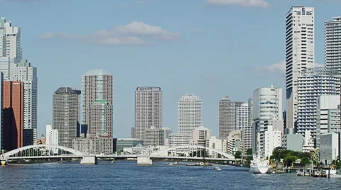 Wide View of Sumidagawa River with High Rise Buildings in Time Lapse Video stock 64331571