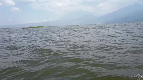 Wide View of Sumurup Lake with Mountains and Gentle Water Waves Stock-Footage 340242542