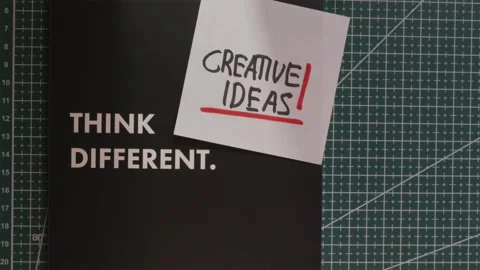 Wide view of Think Different journal and Creative Ideas note Stock Footage 341269476