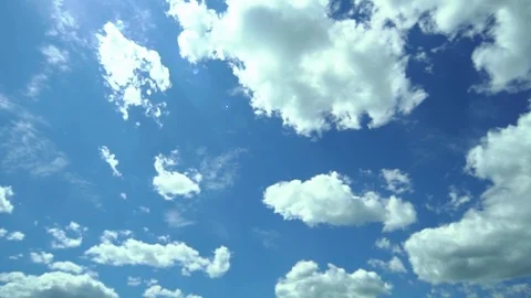 Wide view of torn clouds in the sky. Slow motion. Bright Blue sky. Lot of clouds Video stock 123712880