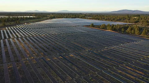 Wide view tracking forward over solar farm near Bend, OR Stock Footage 160931778