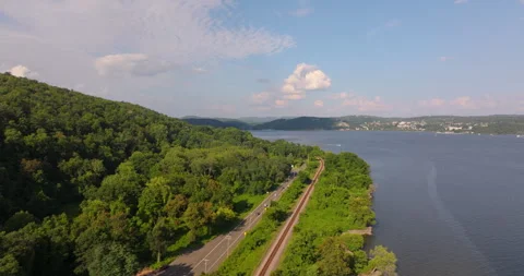 Wide view of train tracks along the Hudson River in New York Stock Footage 346375617