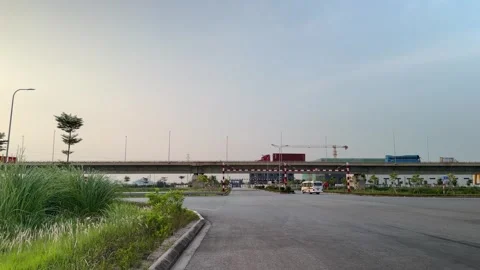 Wide view of trucks on bridge to Lach Huyen Port. Stock-Footage 342579892
