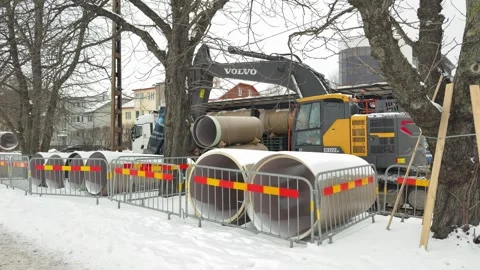Wide view of winter railway construction site with pre insulated pipelines Stock Footage 329699685