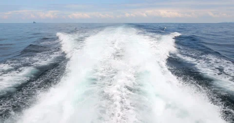 Wide wake from power engines of big catamaran ferry sailing to Tioman Island Stock Footage 314769065