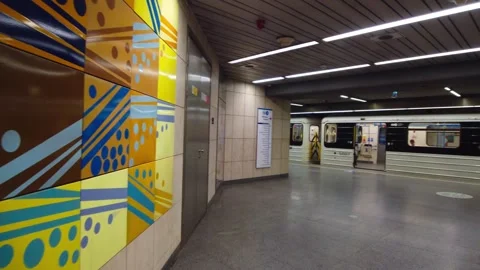 Wide Walking Shot of Modern Empty Subway Platform and Underground Train at Stock Footage 336954776