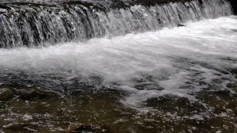 Wide waterfall on a mountain river in dark summer day Foamed water Falling Stock Footage 116719447