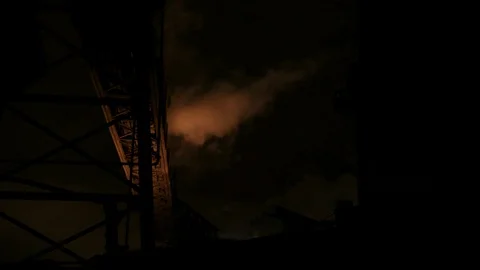 Wider shot of Apocalyptic industrial scape at night Stock Footage 89945409