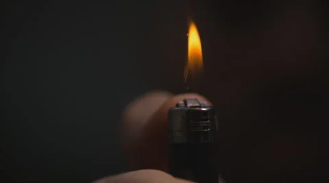 Wider shot of macro lighter slow motion Video stock 63625297
