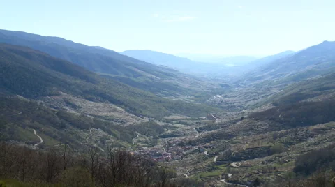 Wider on straight valley from vantage point at mountain pass Stock Footage 49652902