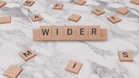 WIDER word written on scrabble Stock Footage 256875778