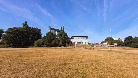 Widnes Catalyst science discovery centre museum golden Spike island grass fields Stock Footage 342332037
