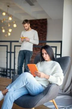 Wife feeling concerned while checking working schedule Stock-Fotos