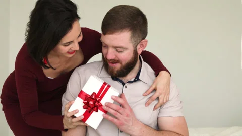 Wife hugs husband makes surprise. | Stock Video | Pond5