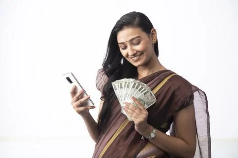 Wife Posing With 500 Rupees Notes And Mobile Phone In Her Hands Stock Photos