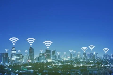 Wifi network connection concept above cityscape background. Stock Photos