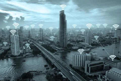 Wifi network connection concept above cityscape background. Stock Photos