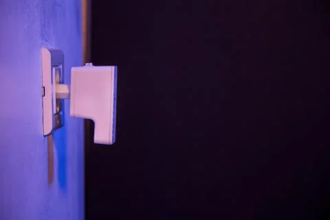WiFi repeater in electrical socket on the wall Stock Photos