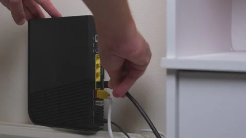 Wifi routers and modem with lan ports. Connect or plug Ethernet cable Stock Footage 245231072