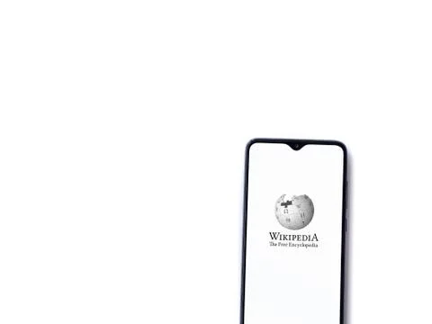 Wikipedia app launch screen with logo on the display of a black mobile smartp Stock Photos
