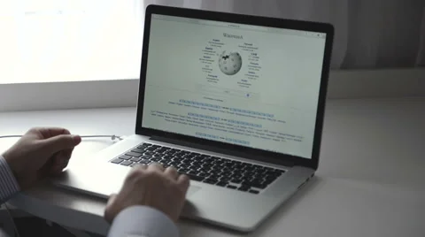 Wikipedia webpage on macbook Stock Footage 43520678