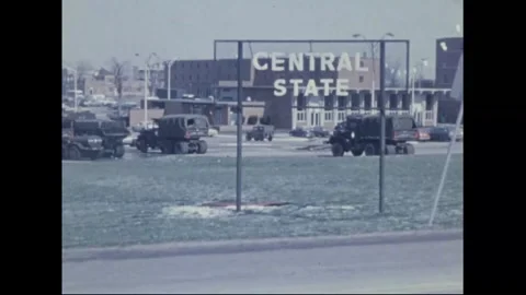 WILBERFORCE, OHIO - 1974: Tornado disaster — Campus sign, Guard trucks below Видео 342609728