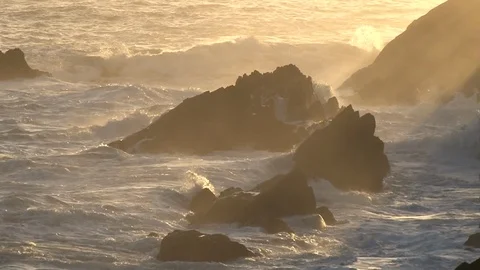 Wild Atlantic waves crashing onto the Irish coast at sunset during a storm Stock Footage