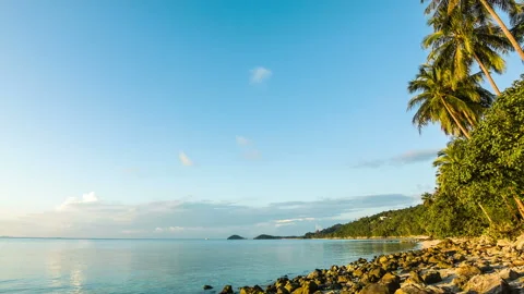Wild beach with rocks at sunset Stock Footage 198430731