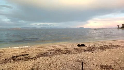 Wild beach in spring against the backdrop of a mesmerizing sky Stock-Footage 306573189